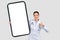 Confident glad european millennial doctor in white coat, with big phone with empty screen show thumb up