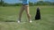 Confident golf player teeing off ball, rejoicing successful shot and gesturing