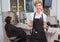 Confident hairdresser smiling at camera