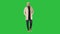 Confident handsome young man wearing coat walking on a Green Screen, Chroma Key.