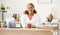 Confident, happy and relaxed business woman looking professional and ready for work at her desk in the office. Young