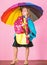 Confident in her fall garments. Waterproof accessories manufacture. Kid girl happy hold colorful umbrella wear