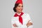 Confident Hispanic stewardess smiling for camera