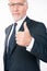 Confident intelligent businessman showing thumb up