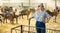 Confident latin-american female farmer posing in goat shed