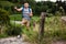 Confident man with prosthesis having a Nordic walking training