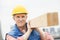 Confident Manual Worker Carrying Wooden Plank