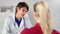 Confident mature European woman professional medic having consultation talking with girl patient