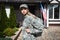 Confident military servicewoman with backpack looking