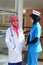 Confident Muslim doctor and nurse busy conversation at hospital