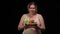 Confident obese Caucasian woman posing with healthy vegetables on plate smiling looking at camera. Overweight plus size