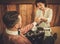 Confident old-fashioned man doing male manicure in a Barber shop.