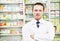 Confident pharmacy chemist man in drugstore