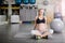 Confident pregnant woman sitting cross legged