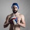 Confident proud portrait of professional water polo player holding ball