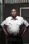 Confident Security Guard Standing At Corrugated Doorway