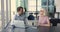 Confident senior business woman talking to younger colleague