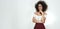 Confident and smart. Wide photo of attractive afro american woman in stylish eyewear and clothes touching her chin