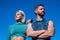 confident sport couple in sportswear relax on sky background, fitness
