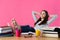 Confident student with her legs crossed up on the table, dreaming