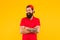 Confident and stylish. Happy hipster yellow background. Bearded man in trendy hipster style. Hipster lifestyle. Cool