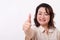 Confident, successful middle aged woman showing thumb up