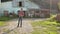 Confident tall young rancher standing near his farms