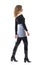 Confident trendy beautiful young woman in stylish modern clothes walking and looking away. Side view.