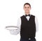 Confident waiter holding empty tray