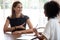 Confident woman job applicant answering hr manager questions during interview