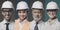 Confident workers wearing safety helmets and smiling