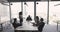 Confident young African American businesswoman standing at meeting table