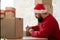 Confident young businessman Santa Claus working in online store for business. Small business owner at his desk. online