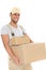 Confident young man carrying cardboard boxes