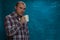 Confident young man posing with coffee