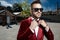 Confident young man wearing red velvet tuxedo