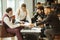 Confident young men in suits coworking in boardroom