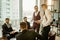 Confident young men in suits coworking in boardroom