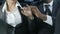 Conflict between upset business man and woman sitting in car, workplace affair