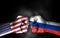 Conflict between USA and Russia, male fists with flags painted on skin isolated on black background