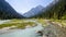 Confluence of pure and muddy rivers on road