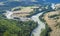 Confluence of two rivers, forested banks