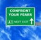 CONFRONT YOUR FEARS road sign against clear blue sky