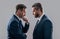 confrontation of two businessmen in suit. photo of businessmen has confrontation look