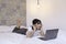 Confuse asian beautiful girl when work the laptop in the bed. Work from home concept