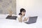 Confuse asian beautiful girl when work the laptop in the bed. Work from home concept