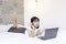 Confuse asian beautiful girl when work the laptop in the bed. Work from home concept