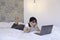 Confuse asian beautiful girl when work the laptop in the bed. Work from home concept