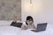 Confuse asian beautiful girl when work the laptop in the bed. Work from home concept