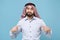 Confused arabian muslim man in keffiyeh kafiya ring igal agal casual clothes isolated on pastel blue background. People